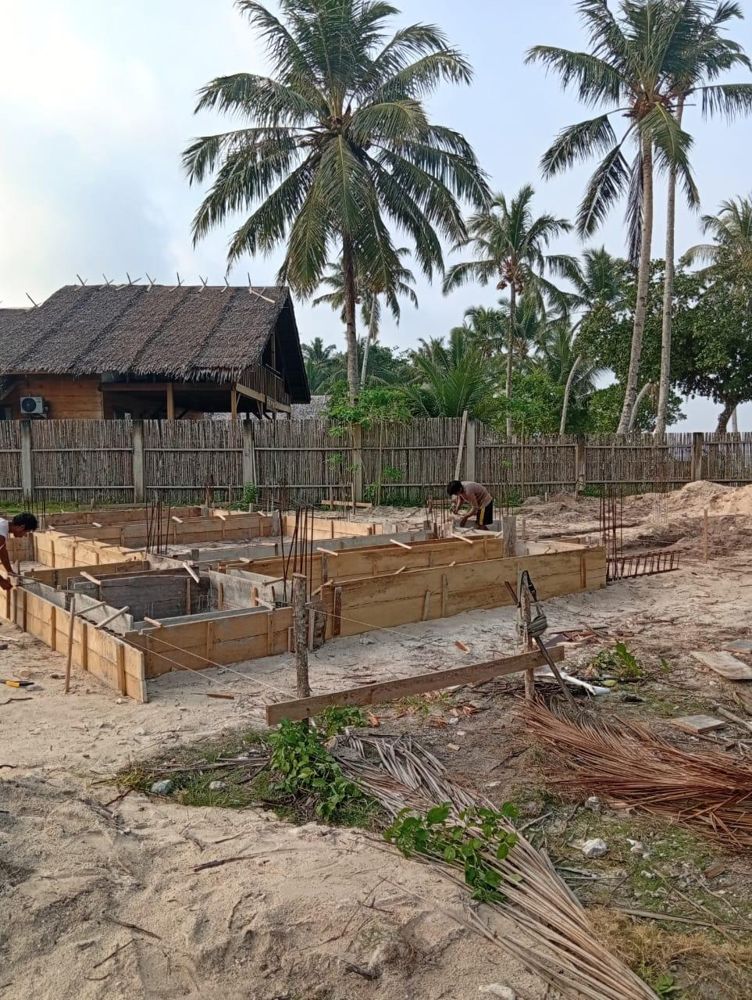 Workers setting up the timber formwork for the foundations
